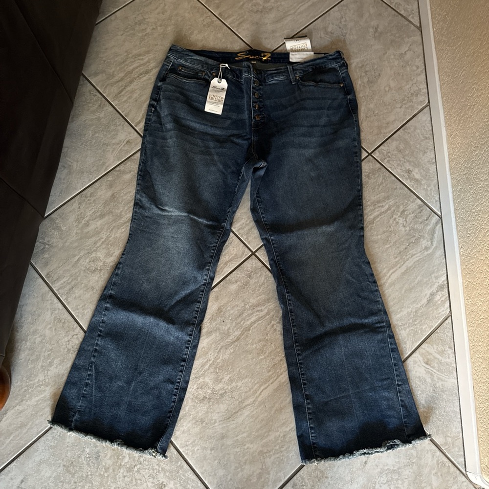 Dark wash flared jeans with frayed hem